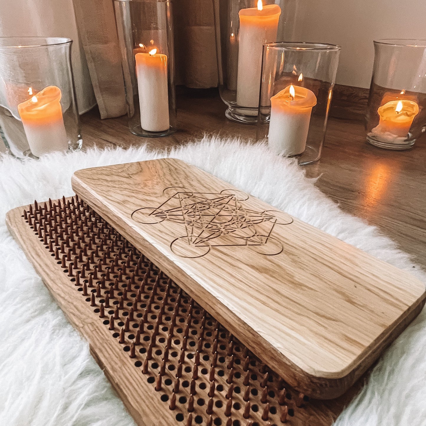 Top view of the Premium Oak Sadhu Board featuring copper nails and Metatron’s Cube design.